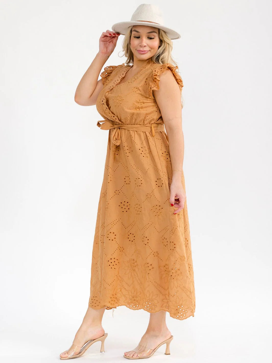 Plus Size Ruffle Sleeve Surplice Elastic Waist Eyelet Maxi Dress worn by a model in a tan color with ruffle sleeves.