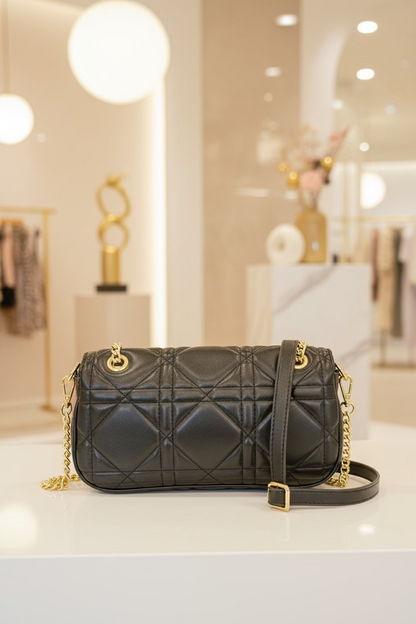 The JANI &amp; TINO Quilted Cylinder Crossbody - Black