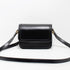 Black Leather Crossbody front view showing sleek design