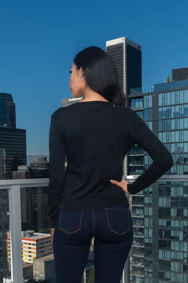 Long Sleeve V-Neck Knit Top With Cut Out Front Detail in Black